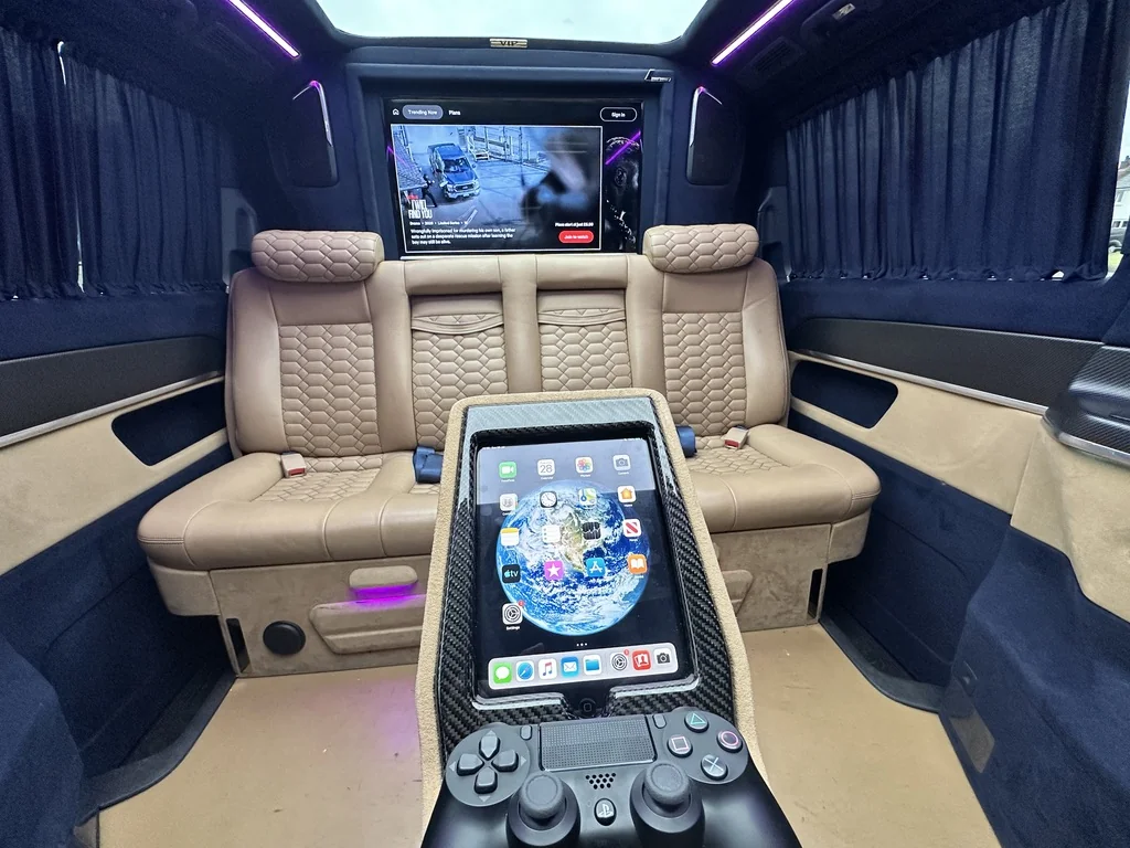 V-Class rear entertainment suite with wall-mounted TV, iPad and games console